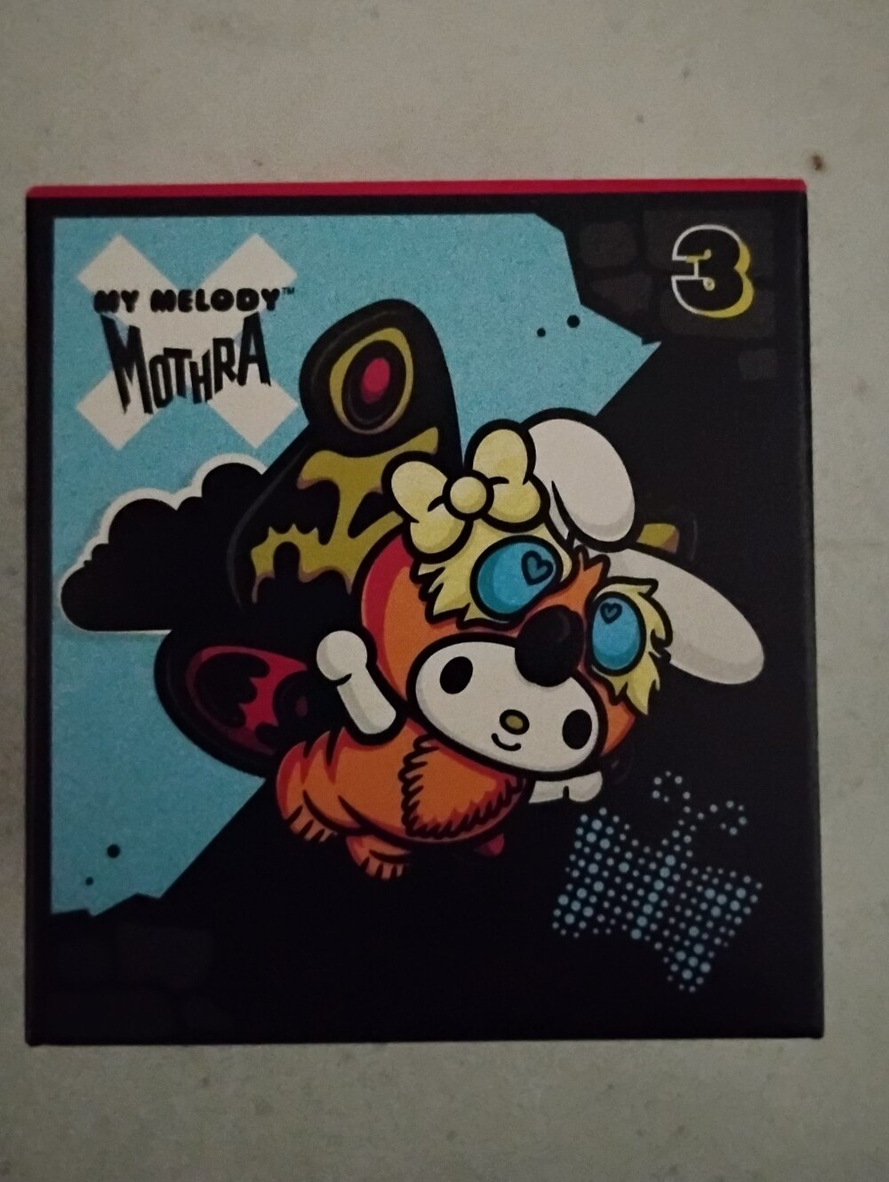 My Melody Mothra Character Art Print - Black/Blue/Orange